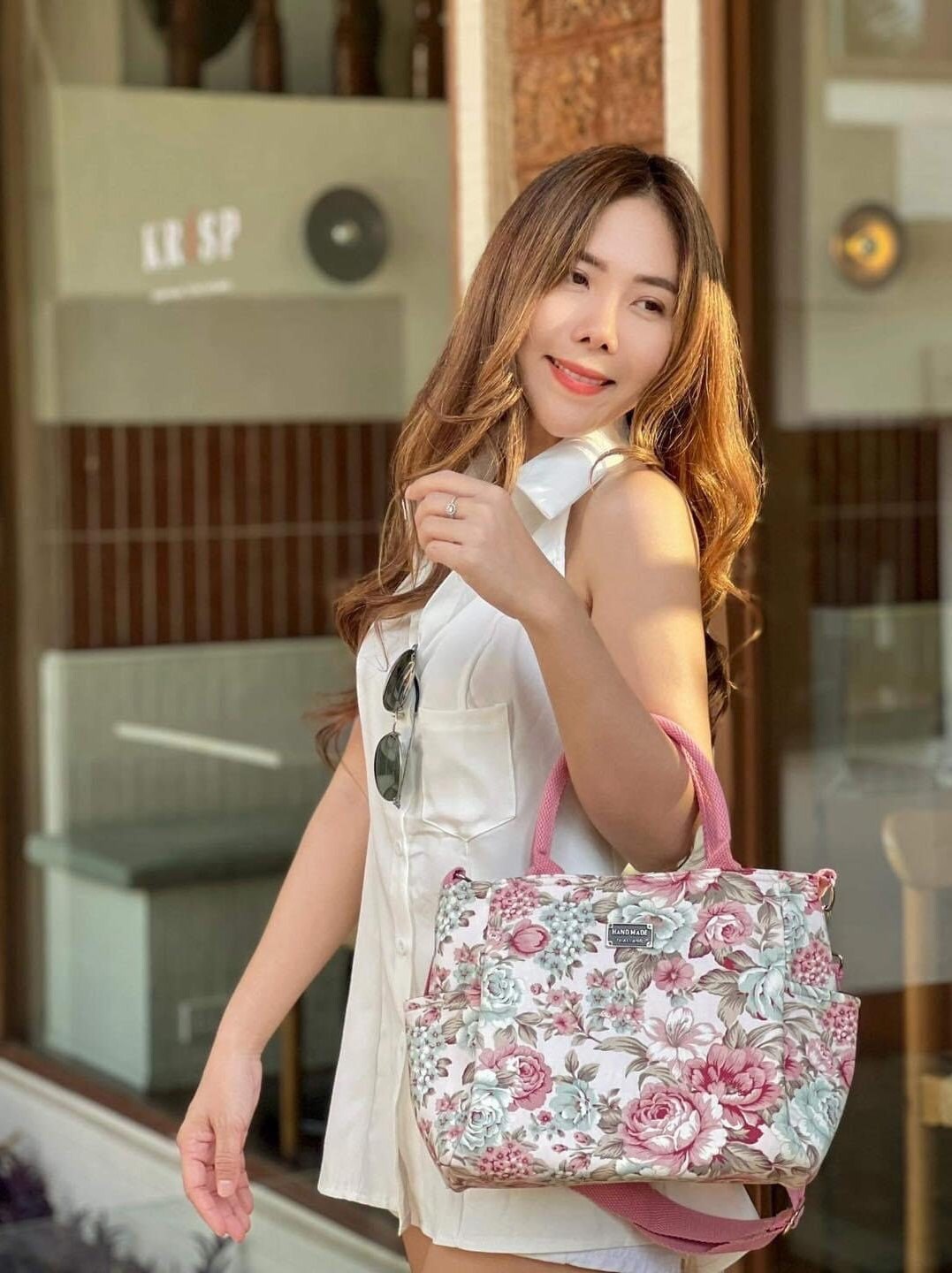 Woman holding Handmade Thailand Handbag in Cream Color Fabric with Pink Rose Pattern