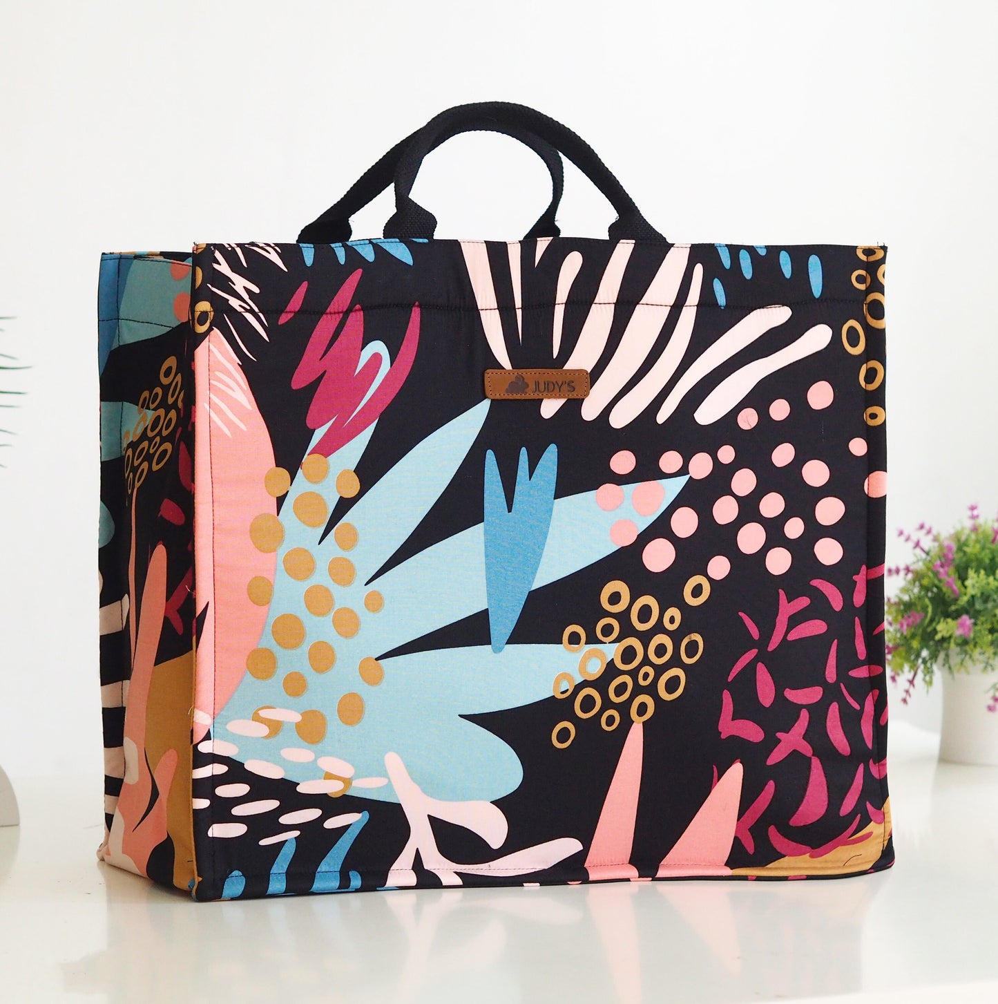 Jumbo Shopping Bag - Unique Floral and Bold Prints - Shown in Bold Pink Blue Tan on Black Pattern.