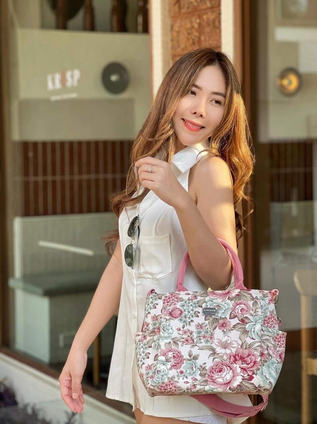 Woman holding Handmade Thailand Handbag in Cream Color Fabric with Pink  Rose Pattern