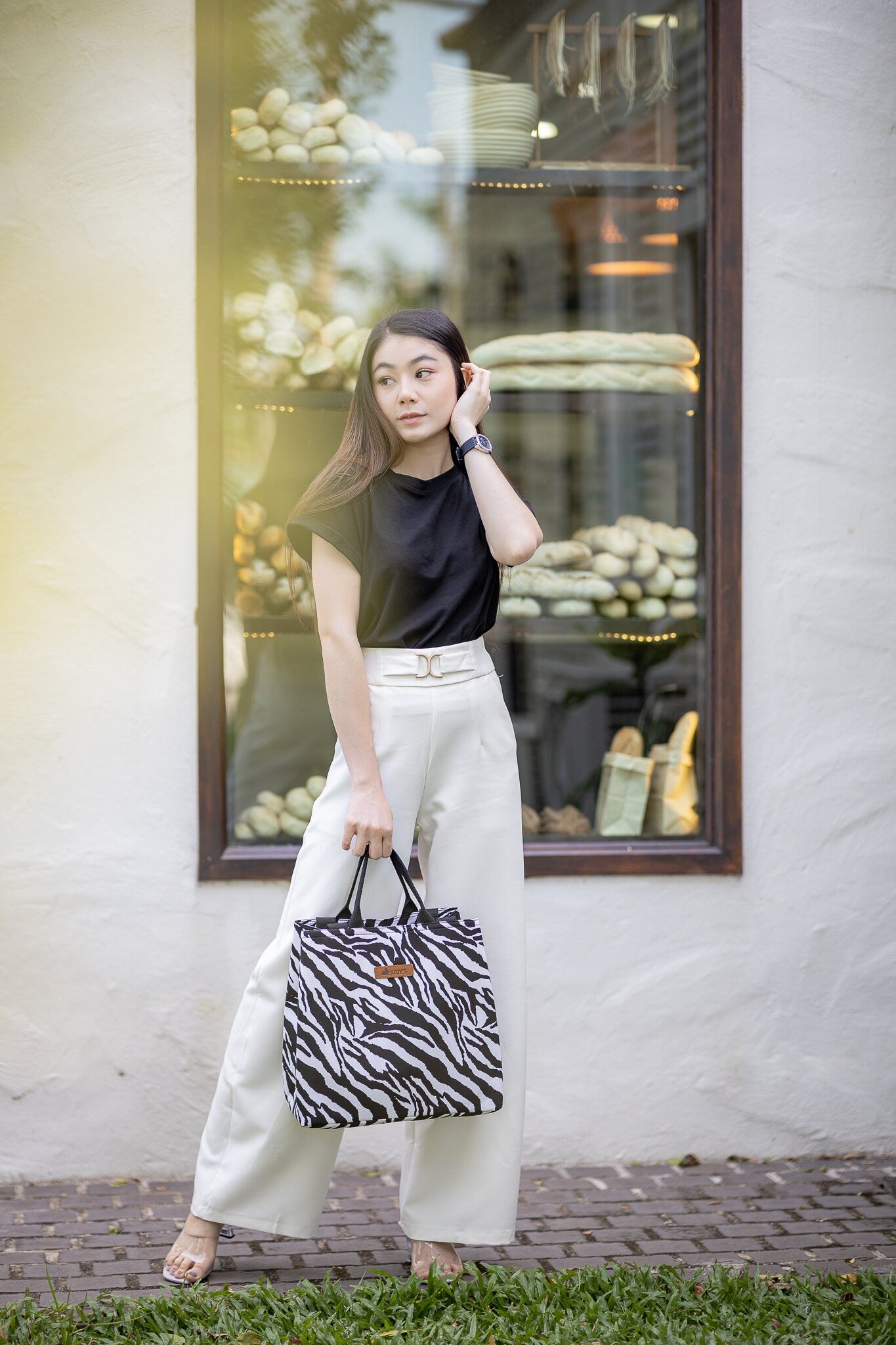 Thai Girl with Large Tank Bag with  Versatile Bucket Shape with Short Handles and Long Shoulder Straps with Zebra Animal Print.