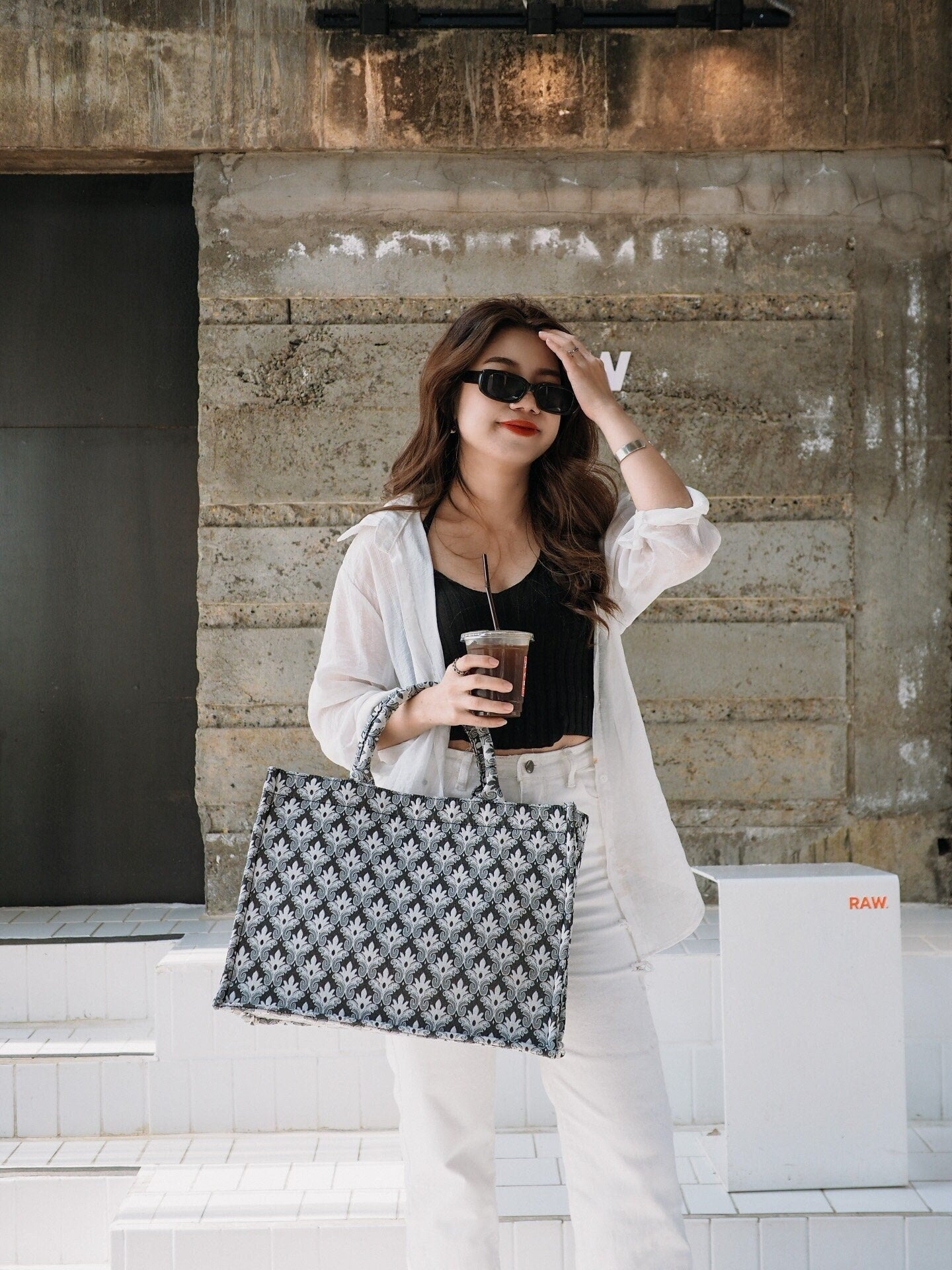 Girl holding Premium Woven Black and Silver Fleur-de-lis Pattern Large Tote Bag