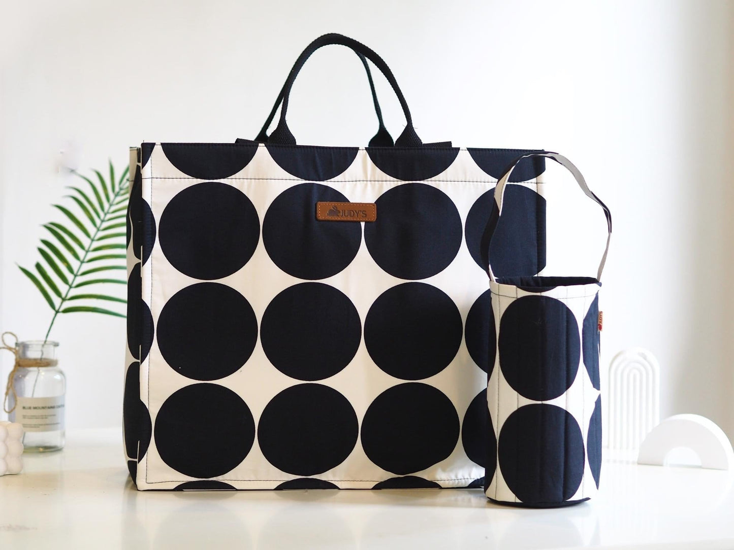 Jumbo Shopping Bag - Unique Floral and Bold Prints - Shown in Large Black Circle Pattern.